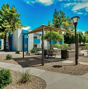 A sunny day at a park with a pavilion, benches, and trees. at Sycamore Square  Apartments, Arizona, 85202