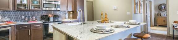 Gourmet Kitchen With Island at Aviator West 7th, Fort Worth