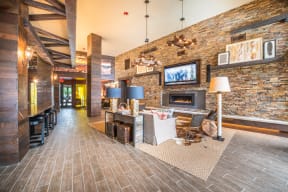 Lounge Area With Stone Fireplace at Aviator West 7th, Fort Worth