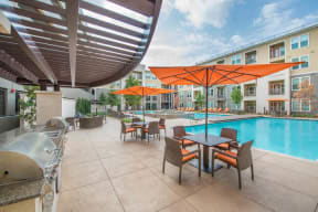 Poolside Sundeck And Grilling Area at Aviator West 7th, Texas