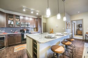 Gourmet Kitchen With Island at Aviator West 7th, Fort Worth