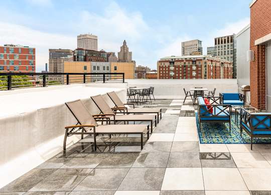 rooftop of station row with sun chairs and tv
