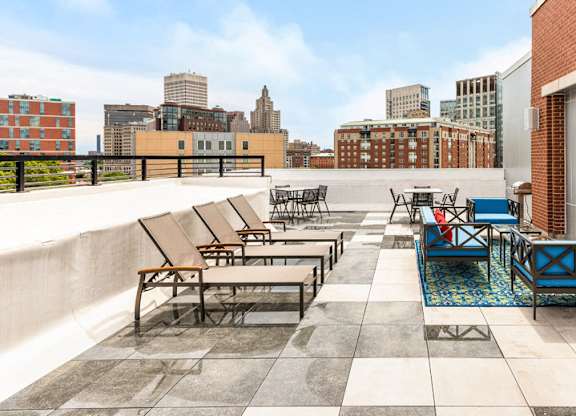 rooftop of station row with sun chairs and tv
