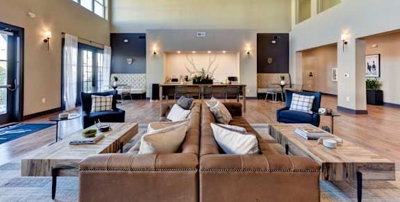 A living room with a white couch and a coffee table.