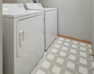 full-sized washer and dryer in laundry room at Williamsburg Park Apartments in Lincoln NE