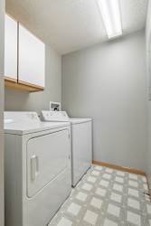 full-sized washer and dryer in laundry room at Williamsburg Park Apartments in Lincoln NE