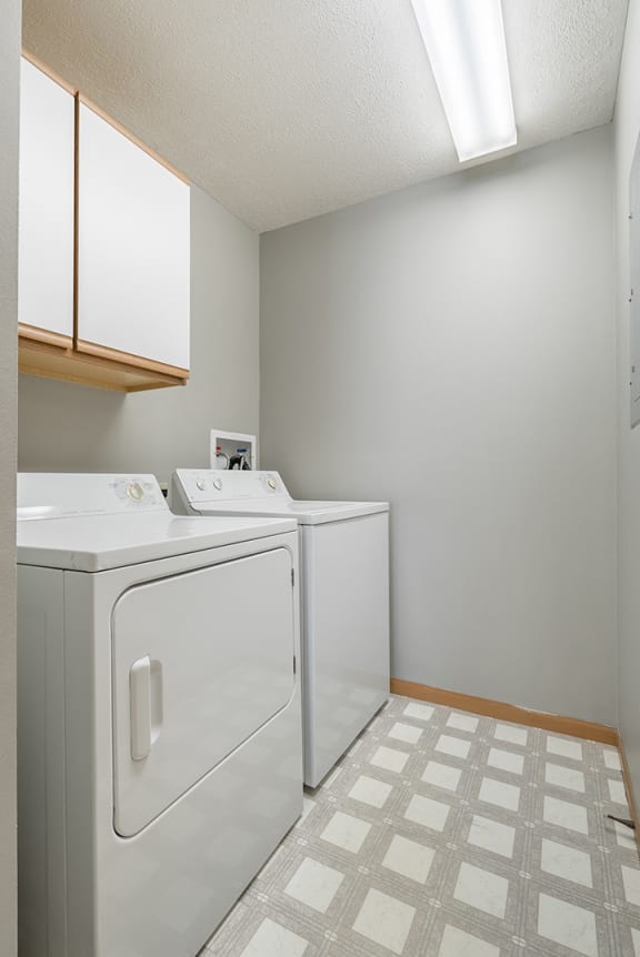 full-sized washer and dryer in laundry room at Williamsburg Park Apartments in Lincoln NE