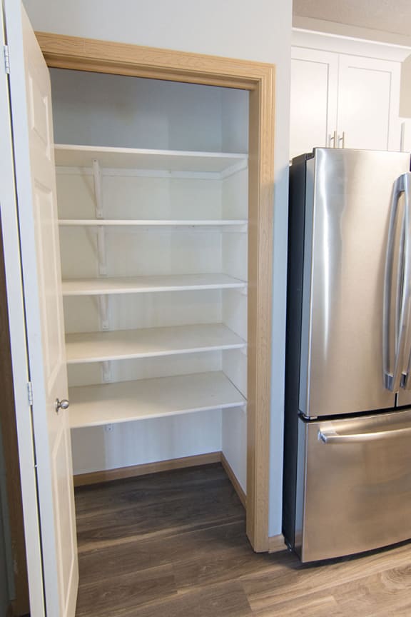 Kitchen pantry with storage shelves at Cascade Pines