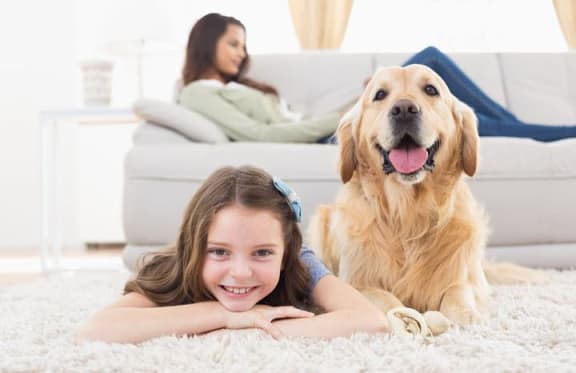 Mother, daughter, and pet.