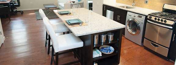 a kitchen and dining area in a 555 waverly unit