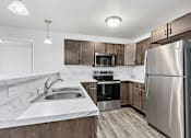 Thumbnail 5 of 32 - Compact Kitchen at Red Rock Apartments, Rapid City