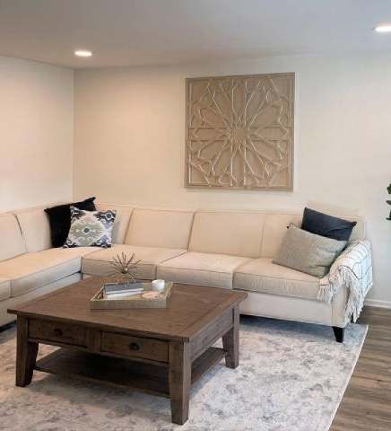 Living room with white couch at Bella Del Mar Apartments, Del Mar, 92014