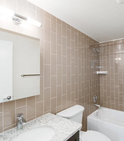 a bathroom with a sink toilet and bathtub