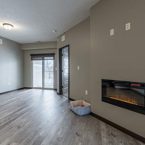 Open floor plan living space including a fireplace at North Pointe Villas