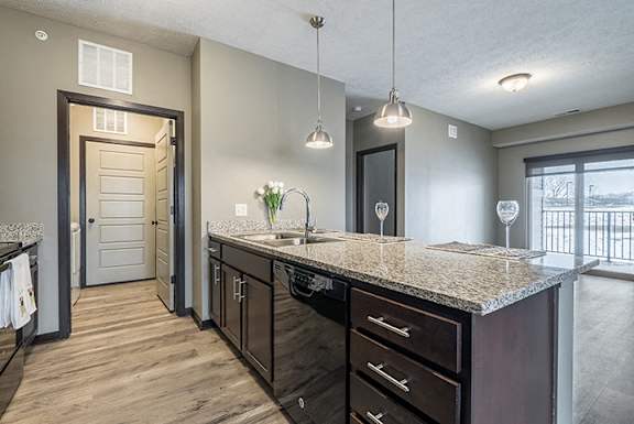 Kitchen with granite counters and island at North Pointe Villas