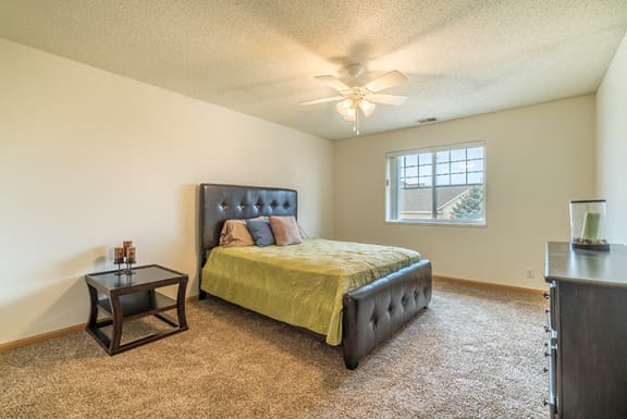 Bedroom with ceiling fan at The Northbrook Apartment Homes, Lincoln, NE