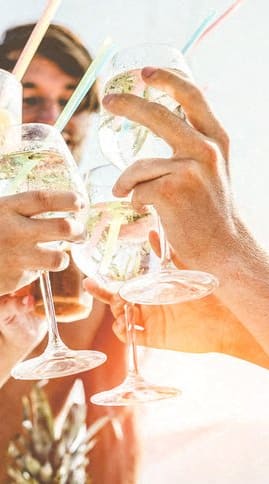 people drinking wine at a beach party