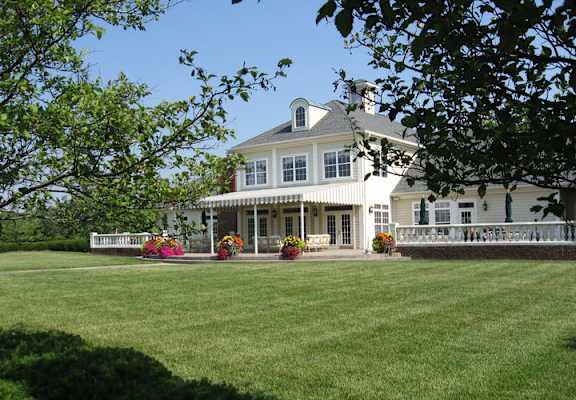 a large white house with a lawn in front of it at Bishops Gate, Cincinnati, OH, 45249