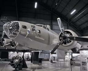 a black and white photo of an airplane in a hanger