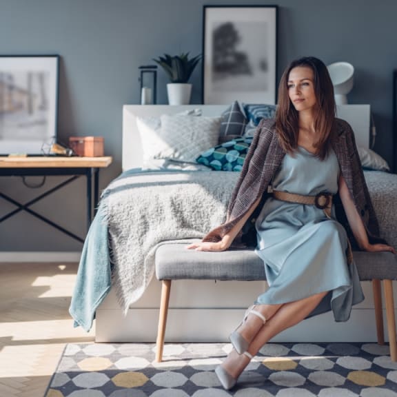 Woman on Bed at Woodmore Apartments, Bowie, Maryland