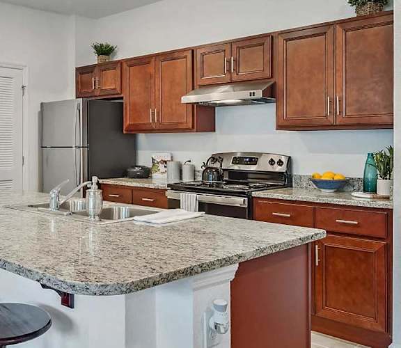 a kitchen with a granite counter top