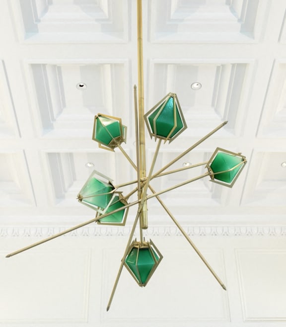 the chandelier hangs from the ceiling in the reception room