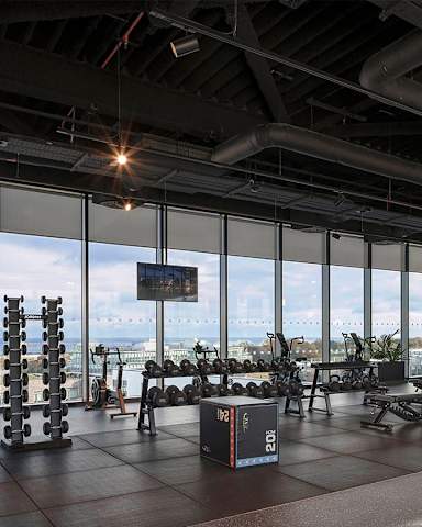 A gym with a view of the city.