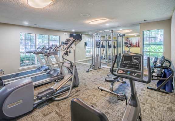 A well-equipped gym with treadmills, elliptical machines, and other cardio equipment. at The Colony at South Park, Aiken