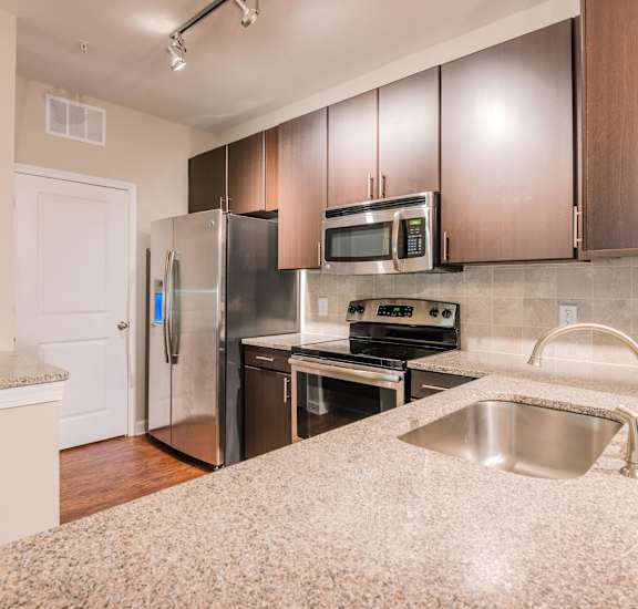 kitchen with granite and stainless appliances