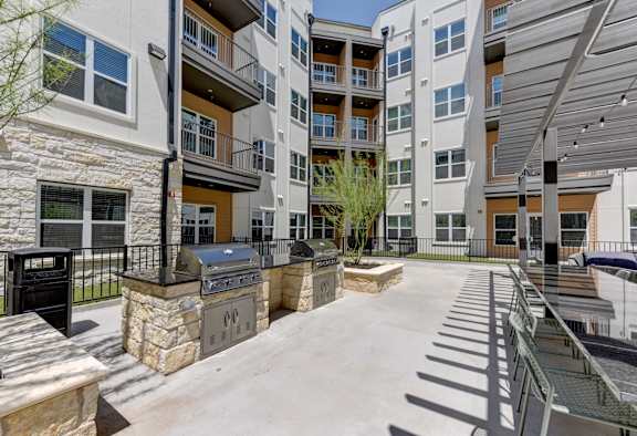 Gas BBQ Grills in the Outdoor Courtyard at Park South Apartments in South Austin, Texas 78748