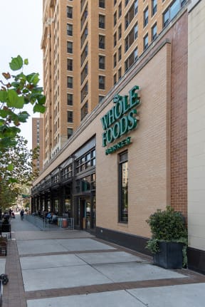 the facade of the whole foods market on a city street