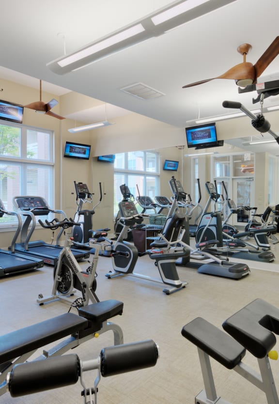 a room filled with lots of different types of exercise equipment