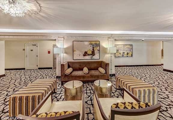 a living room with a couch and chairs and a table at The Chesapeake, Washington, DC 20008