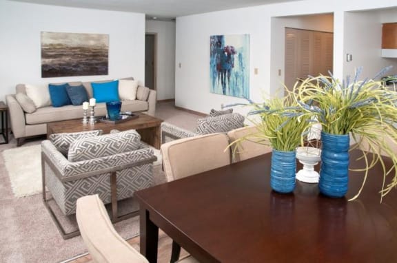 Open Living Room and Dining Room with Hardwood Floors in Bloomington Apartment