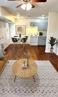 A living room with a brown couch and a patterned rug.