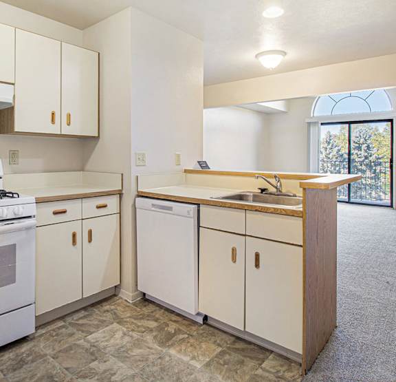 a bedroom with a bed and a ceiling fan at Gull Prairie/Gull Run Apartments and Townhomes, Kalamazoo, MI