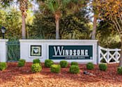 Thumbnail 1 of 25 - Entrance sign with the words: Windsong Apartment Homes listed on the front