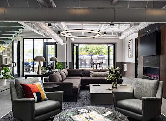 A modern living room with a grey sofa set and a coffee table.