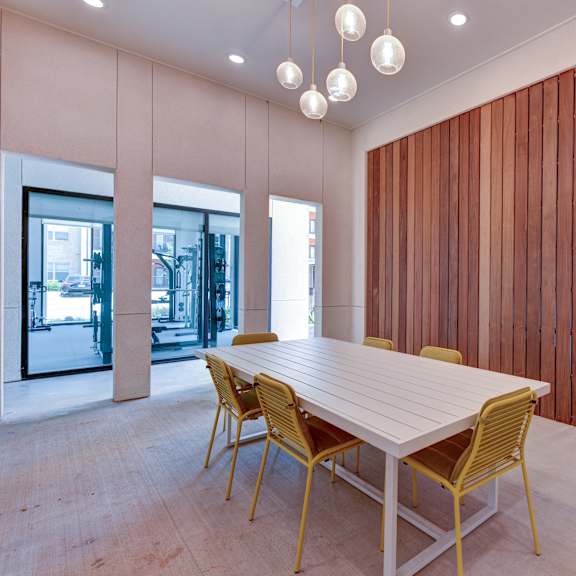 A conference room with a long table and chairs. at Bridge at Saffron, Austin, TX 78717