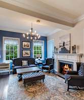 A living room with a fireplace and a couch.