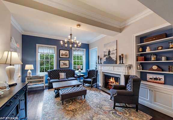 A living room with a fireplace and a couch.