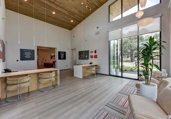 Room with chairs and glass door at Bridge at Saffron, Austin, TX