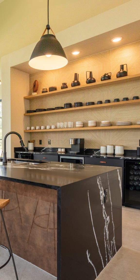 a kitchen with an island and stools