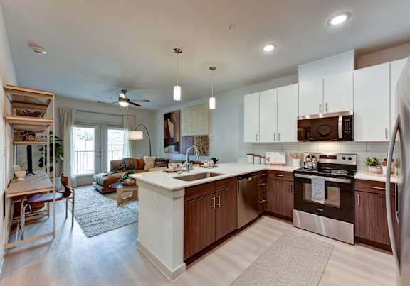 A modern kitchen with a white bathtub. at Bridge at Saffron Apartments, Austin, TX, 78717