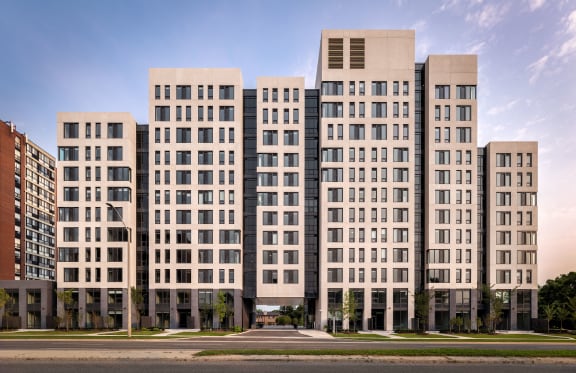 a rendering of a large apartment building with a street in front of it