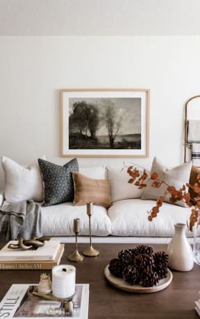 a living room with a white couch and a painting on the wall at 445 Cleveland in Atlanta, Georgia