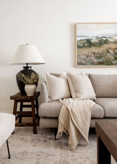 a living room with a couch and a lamp at Woodbriar Management, LLC, Tucker, GA, 30084