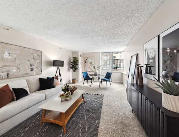 a living room with a white couch and a coffee table