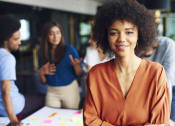 Thumbnail 2 of 4 - a woman sitting at a table with a group of people at Proximity at ODU, Norfolk, Virginia