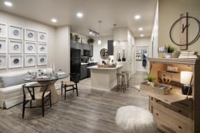an open kitchen and living room with a table and chairs